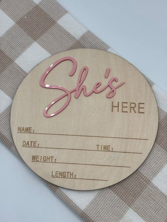 She's Here sign